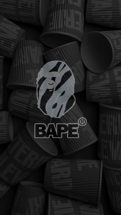 the bape logo is surrounded by many black barrels