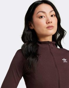 Tops by adidas Originals Your cart called, it wants this High neck Long sleeves Zip fastening Logo embroidery Slim fit Fall Athleisure Activewear With Three Stripes, Sporty Brown Track Jacket With Long Sleeves, Spring Track Jacket With Three Stripes Branding, Sporty Brown Long Sleeve Tops, Sporty Brown Tops For Fall, Brown Long Sleeve Sporty Tops, Brown Athleisure Activewear For Fall, Fitted Adidas Sportswear Tops, Adidas Sportswear Top For Fall