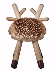 an animal stool made out of wood and fur on it's backrests