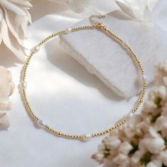 ✨Discover timeless elegance with our Natural Freshwater Pearls Choker. This gold color beaded necklace features minimalist pearl design, perfect for adding a touch of sophistication to any outfit. Ideal as a birthday gift or a special treat for yourself, this necklace is a versatile and stylish addition to any jewelry collection. Key Features:  * Natural Freshwater Pearls: Exquisite and genuine pearls for a classic look.  * Gold Color Beaded Necklace: Adds a touch of luxury and elegance.  * Mini Dainty Pearl Necklace With Gold Beads, Minimalist Pearl Beaded Necklace, Minimalist Gold Beaded Necklaces With Pearl Drop, Gold Minimalist Beaded Necklace With Pearl Drop, Minimalist Gold Beaded Necklace With Pearl Drop, Minimalist Gold Pearl Beaded Necklace, Gold Minimalist Beaded Necklaces With Pearl Drop, Dainty Pearl Beaded Choker Necklace, Dainty Gold Choker With Pearl Drop