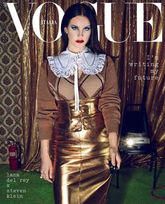 a woman in a gold skirt on the cover of a magazine