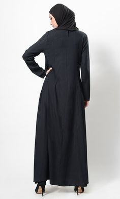 Featuring a classic comfortable flared full length abaya dress in rayon fabric adorned with three striped panels and metallic button studded detail on the yoke. It has pleated panels all over the skirt with an asymmetrical comfortable silhouette to be worn casually during the day.FIT : Relaxed fit.COMPOSITION : Rayon.CARE : Dry clean only. Spring Abaya With Modesty Panel, Modest Maxi Length Abaya For Fall, Fall Modest Maxi Length Abaya, Fall Season Modest Maxi Length Abaya, Long Sleeve Abaya With Modesty Panel For Fall, Maxi Length Abaya For Fall Workwear, Fall Long Sleeve Abaya With Modesty Panel, Fall Workwear Abaya In Maxi Length, Fall Workwear Maxi Length Abaya