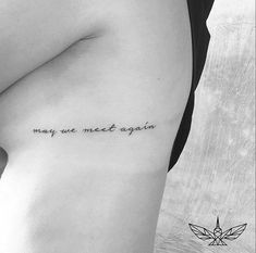 a woman's stomach with the words may we meet again written on her right side