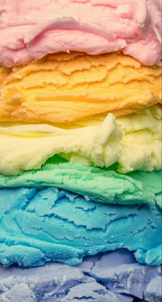 four different colored ice creams stacked on top of each other