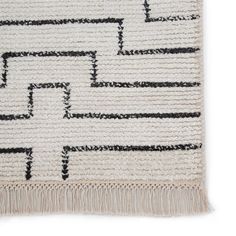 a white rug with black lines on it