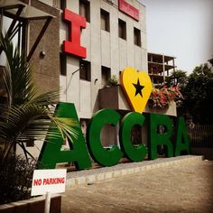 there is a sign that says acra in front of a building with a star on it