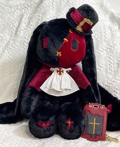 a stuffed animal with a cross on it's chest