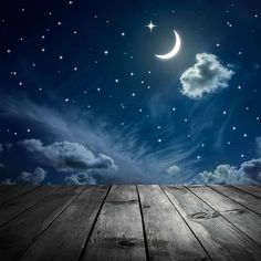 the night sky is full of stars and clouds, as well as a half moon