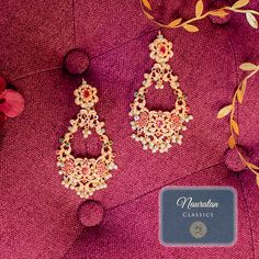 Giving out an elegant vibe owing to its sparkling stone mix! A versatile pair of earrings encrusted with nauratan stones and pearl moti. Approximate earrings length is 4". Pair Niti Earrings with Zehna Teekah for a complete festive look. Gold-plated on high-quality brass as base metal. Made by order. Kindly allow 4-6 weeks for the delivery of this item. For custom or urgent requests, please contact support@alacouture.com. *Please Note: We use faux stones and beads in all of our jewelry. Festive Fusion Chandelier Earrings With Stone Work, Fusion Style Jeweled Bridal Earrings For Diwali, Fusion Jeweled Bridal Earrings For Diwali, Diwali Fusion Bridal Jeweled Earrings, Festive Fusion Jeweled Chandelier Earrings, Fusion Style Pearl Drop Danglers For Celebrations, Fusion Style Jeweled Danglers For Wedding, Elegant Bridal Earrings For Wedding And Navratri, Fusion Jeweled Danglers For Wedding