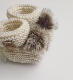 Our knitted booties are simple yet elegant, perfectly fitted to your babies feet during the cold winters. They also make the perfect baby shower gift or newborn photoshoot prop. Available in the colors: gray, ivory, black, and beige. Made with 100% wool yarn (highly recommended to be worn over socks) *Bigger size booties are made with real leather soles for stability. Handmade in a smoke and pet free environment. Photos by Instagram mamas: @jessicastatezni @alenka.savchik *Hand wash with cold wa Knitted Baby Socks, Baby Socks Knit, Boy Or Girl Baby, Knit Baby Booties, Handmade Yarn, Knitted Booties, Booties Shoes, Photoshoot Props, Crochet Booties