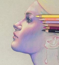 a pencil drawing of a woman's face with different colored pencils on it