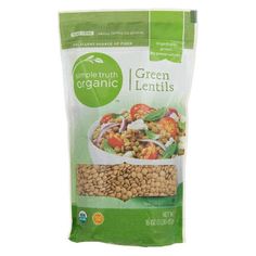 organic green lentils with tomatoes and spinach in a bag on a white background