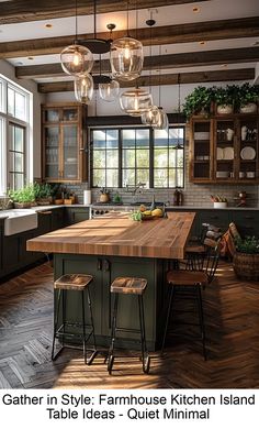 a large kitchen island with stools in front of it and lights hanging from the ceiling