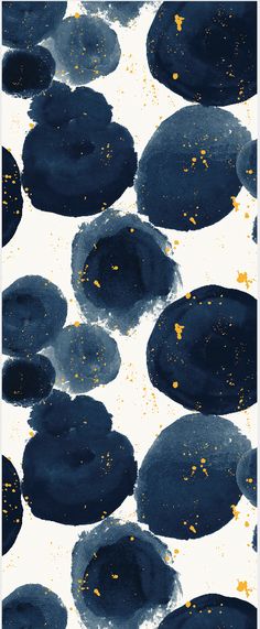 black and gold paint splattered on white paper with yellow dots in the middle