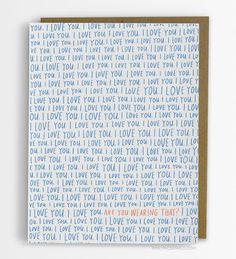 a greeting card with the words i love you in blue and orange on white paper