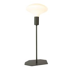 a lamp that is sitting on top of a metal stand with a white light in the middle