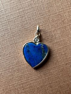 "Please, read full description! Please, don't rely on your expectations, the exact size is described below  14k solid yellow gold, natural white diamond and natural blue lapis lazuli heart pendant, small size The chain is not included!  All metal components are 14k solid yellow gold The heart is natural blue lapis lazuli, 10mm by 10mm by 2mm, flat polished cabochon, beautiful royal blue color. The small natural diamond is round, 1.7mm, 0.02 carats, nice and sparkly  Length of the pendant top-bot Blue 14k Gold Heart Pendant Jewelry, Anniversary Sapphire Lapis Lazuli Jewelry, Sapphire Lapis Lazuli Jewelry For Anniversary, Yellow Gold Lapis Lazuli Cabochon Jewelry, Blue Sterling Silver Jewelry Stamped 14k, Blue 14k Gold Jewelry With Heart Cut, Blue 14k Gold Heart Cut Jewelry, Anniversary Yellow Gold Lapis Lazuli Jewelry, Blue Lapis Lazuli