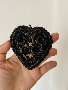 Embrodered black velvet heart with applications - vintage folk inspiration pendent. Made entirely by hand. It can be used with a chain, bead necklace, satin or velvet ribbon.  Approximate measurements: 8 cm x 7,5 cm x 2 cm Color: Black and gold Materials: velvet, beads and metalic golden thread. It can't be washed. The colors may be different than what appears on the screen of the gadget. Thank you! Bohemian Black Embroidered Jewelry, Black Embroidered Bohemian Jewelry, Velvet Heart, Gold Embroidery, Felt Brooch, Heart Decorations, Velvet Ribbon, Girl With Hat, Black Velvet