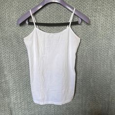 Plain White Tank Top. Never Worn ! Let’s Repurpose It . Fits Like A Women’s Small. Basic White Stretch Camisole, White Stretch Basic Camisole, White Stretch Camisole Casual Style, Basic White Camisole Top, Casual Solid Color Cotton Camisole, Basic White Cami Top, Basic White Camisole For Spring, White Basic Camisole For Spring, White Cotton Camisole Tops