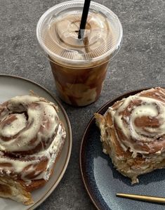 two plates with pastries on them next to a cup of coffee