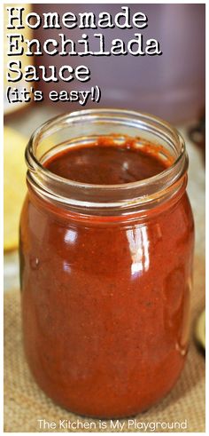 homemade enchilada sauce in a mason jar with text overlay reading homemade enchilada sauce gets easy the kitchen is my playground