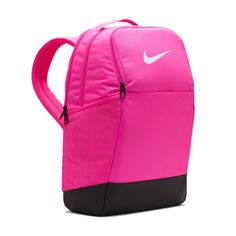 Grab your gear and get going with the Nike Brasilia Backpack. It has plenty of pockets to help you stay organized, including a sleeve to fit your laptop, side mesh pockets for water bottles, and a zippered pocket on the inside to keep small items secure. This product is made with at least 50% recycled polyester fibers. Haul loop at the top. Spacious main compartment. Padded, adjustable shoulder straps. Front zip pocket. Internal laptop sleeve. Dimensions: 18" H x 12" W x 7" D. Capacity: 24 L. Sh Nike Functional Backpack For Outdoor Activities, Pink Functional Outdoor Backpack, Functional Pink Outdoor Backpack, Pink Bags For Outdoor And Back To School, Nike Nylon Backpack For Travel, Nike Nylon Travel Backpack, Nike Nylon Standard Backpack, Functional Pink Gym Bag For Sports, Sporty Pink Standard Backpack