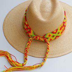 These Beautiful hat bands are carefully hand woven by Rosa in Chiapas,Mexico. Each band showcases a unique and colorful patterned design using traditional macrame techniques. Add a touch of handmade artistry to your hat collection today! Width 1 3/4” Length: 23 inches, not including fringe Fringe 10” each side Fits most hats Polyester yarn All items are shipped from US. All Mi Mundo Mexicano items are 100% handmade by artisans in Mexico. Each stitch and item is completely unique and one-of-a-kin Macrame Techniques, Leather Embroidery, Hat Bands, Hat Collection, Polyester Yarn, Beautiful Hats, Hat Band, Artisan Craft, Hand Woven