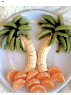 a white plate topped with sliced oranges and banana's on top of each other