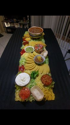 a long table with many different foods on it