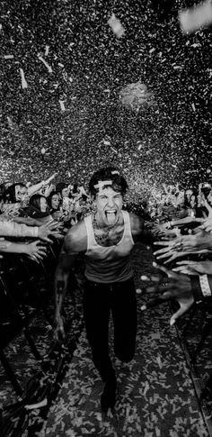 black and white photograph of a man surrounded by confetti