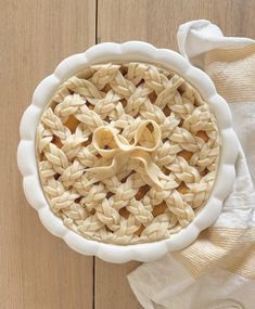 an uncooked pie sitting on top of a wooden table