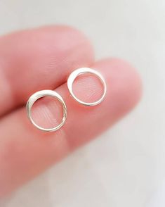 Circle stud earrings, simple & modern. • T H E • D E T A I L S • • All components are Sterling silver, Gold Vermeil, Rose Gold Vermeil, or Oxidized Silver• Circle measures 10mm across (just over 3/8")• Thoughtfully packaged & ready for gift giving!• Handmade, just for you, in our sunny California Studio• Our 365 Guarantee: Our jewelry is guaranteed for 1 year after purchase date against defects.• Your earrings are sent in a gloss white jewelry box & our signature "Studio Blue" satin Anniversary Jewelry With Matching Earrings, Pierced Open Circle Jewelry Gift, Delicate Pierced Round Earrings, Delicate Round Pierced Earrings, Dainty Circle Nickel-free Earrings, Dainty Circle Earrings For Pierced Ears, Dainty Circular Earrings, Tiny Modern Earrings For Gift, Modern Tiny Earrings For Gift