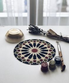 a table topped with different types of crafting supplies