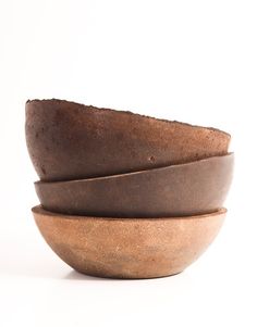 three brown bowls stacked on top of each other