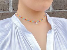 "This chic, colorful but simple necklace will add an extra ✨ to your everyday style. You can layer it with your favorite accessory or wear it on its own! P R O D U C T * D E T A I L S Materials :: premium seed beads, gold-plated clasp Chain Length :: 14\" / 16\" / 18\" C A R E * I N S T R U C T I O N S Please remember that all our jewelry is handmade, so handle it with care and love. Also note that gold or silver-colored pieces may tarnish over time depending on the frequency of use and care taken when using the items. To prolong the life of these pieces, we strongly advise storing them separately, away from direct sunlight and moisture, and avoid wearing them near water. Handcrafted by FOR MY MUSE" Adjustable Multicolor Choker For Spring, Casual Beaded Necklaces For Spring Gift, Casual Handmade Beaded Necklaces For Spring, Casual Beaded Necklace For Spring Season Gift, Trendy Tiny Beads Necklace For Spring, Spring Multicolor Jewelry With Tiny Beads, Multicolor Choker Necklaces For Spring, Spring Multicolor Tiny Beads Jewelry, Multicolor Choker Necklace For Spring