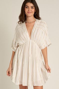 Introducing the Ivory Stripe Kimono Mini Dress, featuring eye-catching lurex stripes and kimono-style sleeves. Made with high-quality materials, this dress offers a comfortable and elegant fit. Elevate your style with this versatile piece that can be dressed up or down for any occasion. Fabric & fit:Shell: 100% Rayon | Lining: 100% Cotton Model is wearing size Small. Kimono Mini Dress, Ladies Tops, Tops Fashion, Kimono Style, Kimono Fashion, Ladies Tops Fashion, Elevate Your Style, Street Styles, Your Style