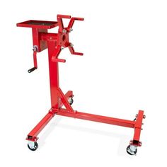 a red work stand with wheels on it