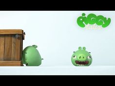 two angry birds are standing in front of a wooden box with the word piggy tales written on it