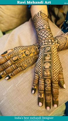 a woman's hands with hendi designs on it