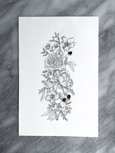 a black and white drawing of flowers on paper