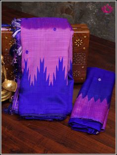 Berhampuri silk was introduced at Berhampur town in 14th century AD by the Mohuri Kings. It is known as ‘Silk City’ for its pure silk weaves. This Berhampuri silk saree is one of the traditional weaving and handloom heritage from Odisha. Embrace grace in this simple Berhampuri double pallu saree in purplish pink with Phoda kumba borders in blue. Extended pallu in altenate pink and Blue with small buttas adds elegance. Handmade custom tassels adds beauty to this classy pick. Blouse - Unstitched. Berhampuri Silk Saree, Purple Slub Silk Saree For Puja, Handloom Raw Silk Blouse Piece For Traditional Ceremonies, Navratri Handloom Tussar Silk Blouse Piece, Tussar Silk Saree Blouse Piece For Rituals, Handloom Slub Silk Saree For Traditional Ceremonies, Slub Silk Saree With Cutdana For Rituals, Raw Silk Saree With Weaving Work For Rituals, Handloom Tussar Silk Saree For Traditional Ceremonies