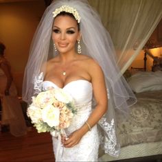 a woman in a wedding dress holding a bouquet