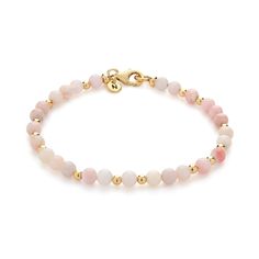 Nellou's Birthstone Bracelets are the perfect way to celebrate, this Pink Opal is the birthstone for October birthdays or just indulge in the soft beauty of pink opal! This bracelet features delicate pink opal gemstones that radiate serenity and grace with their gentle, rosy hue. Its sleek, modern design effortlessly adds a touch of elegance to any outfit, whether for wearing everyday or searching for the perfect birthstone gift. With natural pink opal stones nestled among 18ct gold plated eco-friendly sterling silver beads and fastenings, this bracelet is a must-have addition to your jewellery collection. Pink Opal: compassion | emotional healing | love We want your jewellery to stay in great condition so you can enjoy it for years to come. With some simple steps you can help prolong the October Birthdays, Soft Beauty, Birthstone Bracelet, Forever Jewelry, Birthstone Gifts, Birthstone Bracelets, Jewelry Ring Box, October Birthstone, Pink Opal