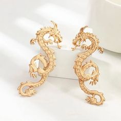 Experience The Captivating Allure Of These 2.5 In (65mm) Dragon Statement Earrings. These Exquisite Earrings, Available In Matte Gold And Silver, Feature An Intricate Asian Dragon Design That Will Add A Touch Of Boldness To Any Outfit. Dragon Totem, Dragon Decor, Dragon Earrings, Golden Dragon, Dragon Jewelry, Long Dangle Earrings, Stud Earrings For Women, Online Earrings, Gold Pendant Necklace