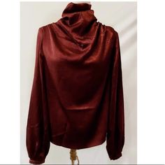 Burgundy High Neck Draped Front Blouse With Lantern Sleeves. Size S Bust: 37.4’ Sleeve Length: 25.6’ Length: 24.4’ Cuff: 7.9’ Size M Bust: 39’ Sleeve Length: 26’ Length: 24.8’ Cuff: 8.3’ Size Lg Bust: 41.3’ Sleeve Length: 26.5’ Length: 25.4’ Cuff: 8.9’ Burgundy Tops For Fall Party, Burgundy Blouse For Fall Night Out, Burgundy Top For Fall Party, Fall Party Burgundy Blouse, Fall Party Burgundy Top, Elegant Burgundy Fall Blouse, Lantern Sleeved Blouses, Lantern Sleeves, Lady In Red