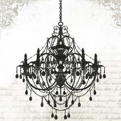 a black chandelier hanging from the ceiling in front of a wall with writing on it