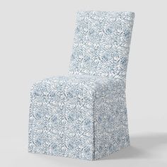 a blue and white chair sitting on top of a floor