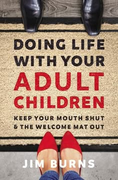 a person standing in front of a door mat with the words doing life with your adult children