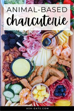 an animal - based charcuterie platter with cheese, meats and fruit