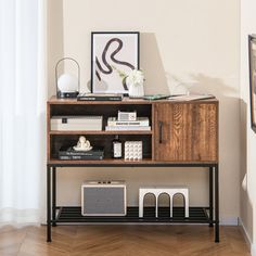 a wooden shelf with speakers and other items on top of it in a living room